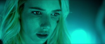 Movie still from “Nerve” (2016), directed by Henry Joost – A woman's face in green light; Close Up shot, Low angle