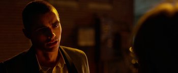 Movie still from “Nerve” (2016), directed by Henry Joost – A man in a yellow jacket is looking at the camera; Close Up shot, Over the shoulder angle