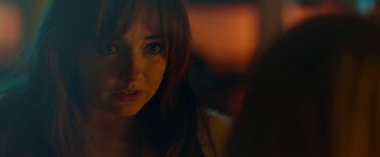 Movie still from “Nerve” (2016), directed by Henry Joost – A woman's face in the dark; Close Up shot, Over the shoulder angle