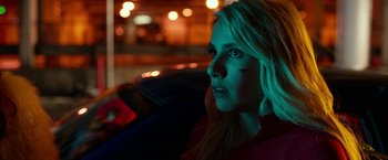 Movie still from “Nerve” (2016), directed by Henry Joost – A woman sitting in the back of a car at night; Close Up shot, High angle