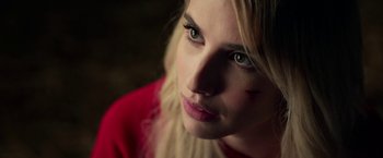 Movie still from “Nerve” (2016), directed by Henry Joost – A woman's face in a red shirt; Close Up shot, High angle