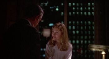 Movie still from “Network” (1976), directed by Sidney Lumet – A man and a woman talking in front of a building; Medium shot, Over the shoulder angle