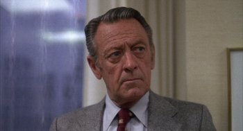 Movie still from “Network” (1976), directed by Sidney Lumet – An older man wearing a suit and tie; Close Up shot, Low angle