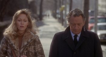 Movie still from “Network” (1976), directed by Sidney Lumet – A man and a woman walking down a sidewalk; Medium shot, Over the shoulder angle