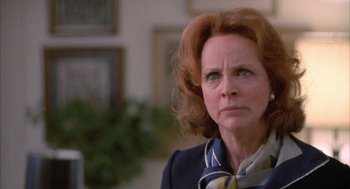 Movie still from “Network” (1976), directed by Sidney Lumet – An older woman with red hair and a plaid shirt; Close Up shot, Low angle