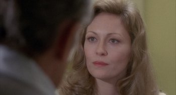 Movie still from “Network” (1976), directed by Sidney Lumet – A person with long blonde hair; Close Up shot, Over the shoulder angle