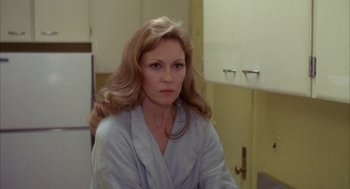 Movie still from “Network” (1976), directed by Sidney Lumet – A woman in a robe in a room; Close Up shot, Over the shoulder angle