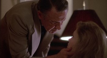 Movie still from “Network” (1976), directed by Sidney Lumet – An older man and a young woman looking at each other; Close Up shot, Over the shoulder angle