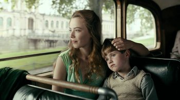 Movie still from “Never Look Away” (2018), directed by Florian Henckel von Donnersmarck – A woman and a young boy sitting on a bus; Close Up shot, Over the shoulder angle