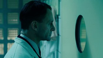 Movie still from “Never Look Away” (2018), directed by Florian Henckel von Donnersmarck – A man looking at himself in a mirror; Close Up shot, Over the shoulder angle