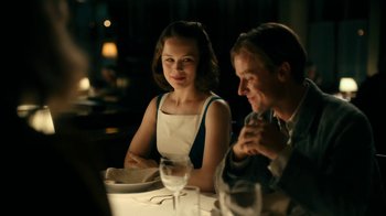 Movie still from “Never Look Away” (2018), directed by Florian Henckel von Donnersmarck – A man and a woman sitting at a dinner table; Medium shot, Over the shoulder angle