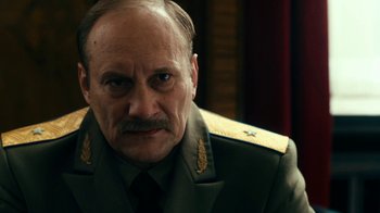 Movie still from “Never Look Away” (2018), directed by Florian Henckel von Donnersmarck – An older man wearing a military uniform; Close Up shot, Low angle