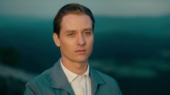 Movie still from “Never Look Away” (2018), directed by Florian Henckel von Donnersmarck – A person wearing a jacket; Close Up shot, Low angle