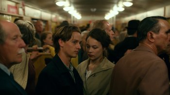 Movie still from “Never Look Away” (2018), directed by Florian Henckel von Donnersmarck – A man and a woman standing next to each other; Close Up shot, Over the shoulder angle