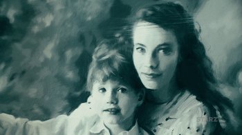 Movie still from “Never Look Away” (2018), directed by Florian Henckel von Donnersmarck – An older woman and a younger woman pose for a picture; Extreme Close Up shot, High angle