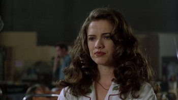 Movie still from “New Nightmare” (1994), directed by Wes Craven – A person with long curly hair; Close Up shot, Low angle