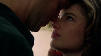 Movie still from “New Nightmare” (1994), directed by Wes Craven – A person's face with a man touching her face; Extreme Close Up shot, Low angle