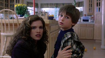 Movie still from “New Nightmare” (1994), directed by Wes Craven – A woman and a young boy in a kitchen; Close Up shot, Low angle