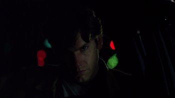 Movie still from “New Nightmare” (1994), directed by Wes Craven – A person in a dark room; Close Up shot, Low angle