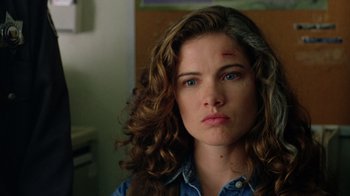 Movie still from “New Nightmare” (1994), directed by Wes Craven – A person wearing a blue shirt; Close Up shot, Low angle
