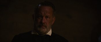 Movie still from “News of the World” (2020), directed by Paul Greengrass – An older man in a black shirt and a white shirt; Close Up shot, Low angle