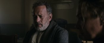 Movie still from “News of the World” (2020), directed by Paul Greengrass – An older man with grey hair and a gray beard; Close Up shot, Over the shoulder angle