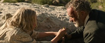 Movie still from “News of the World” (2020), directed by Paul Greengrass – A man and a woman are holding a piece of food; Close Up shot, Over the shoulder angle