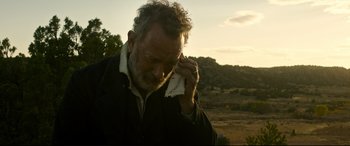Movie still from “News of the World” (2020), directed by Paul Greengrass – An older man is holding a towel to his face; Close Up shot, Low angle