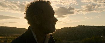 Movie still from “News of the World” (2020), directed by Paul Greengrass – A person with a beard looking into the distance; Close Up shot, Low angle