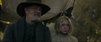 Movie still from “News of the World” (2020), directed by Paul Greengrass – An older man and a young girl under an awning; Close Up shot, Low angle
