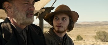 Movie still from “News of the World” (2020), directed by Paul Greengrass – A man with a cowboy hat and a man with a beard; Close Up shot, Over the shoulder angle
