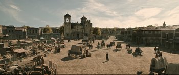 Movie still from “News of the World” (2020), directed by Paul Greengrass – An image of an old western town with a clock tower in the background; Extreme Wide shot, High angle