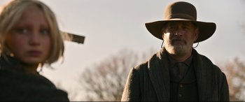 Movie still from “News of the World” (2020), directed by Paul Greengrass – An older man wearing a hat and a coat; Close Up shot, Low angle