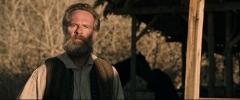 Movie still from “News of the World” (2020), directed by Paul Greengrass – A man with a long beard and a mustache; Close Up shot, Low angle