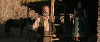Movie still from “News of the World” (2020), directed by Paul Greengrass – A man with a long beard holding a rifle; Medium shot, Low angle
