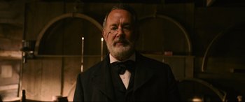 Movie still from “News of the World” (2020), directed by Paul Greengrass – An older man wearing a suit and a bow tie; Close Up shot, Low angle