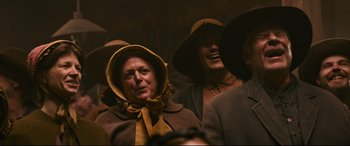 Movie still from “News of the World” (2020), directed by Paul Greengrass – A group of people wearing hats and coats; Medium shot, Low angle