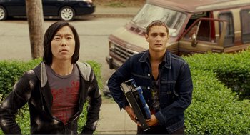 Movie still from “Nick and Norah's Infinite Playlist” (2008), directed by Peter Sollett – Two young men standing next to each other; Medium shot, Low angle