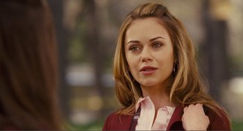 Movie still from “Nick and Norah's Infinite Playlist” (2008), directed by Peter Sollett – A beautiful young lady wearing a red jacket; Close Up shot, Over the shoulder angle