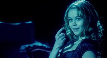 Movie still from “Nick and Norah's Infinite Playlist” (2008), directed by Peter Sollett – A beautiful young lady posing for a picture; Close Up shot, Over the shoulder angle