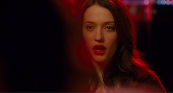 Movie still from “Nick and Norah's Infinite Playlist” (2008), directed by Peter Sollett – A beautiful woman with red lipstick on her lips; Close Up shot, Over the shoulder angle