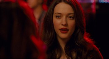 Movie still from “Nick and Norah's Infinite Playlist” (2008), directed by Peter Sollett – A person with long brown hair; Close Up shot, Over the shoulder angle