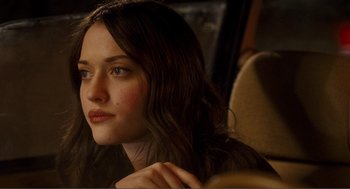 Movie still from “Nick and Norah's Infinite Playlist” (2008), directed by Peter Sollett – A person sitting in a chair; Close Up shot, Over the shoulder angle