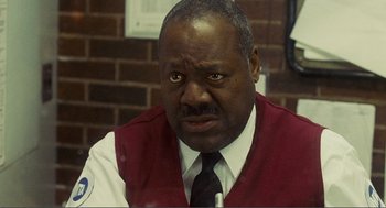 Movie still from “Nick and Norah's Infinite Playlist” (2008), directed by Peter Sollett – A man in a red vest and white dress shirt; Close Up shot, Over the shoulder angle