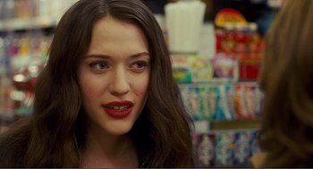 Movie still from “Nick and Norah's Infinite Playlist” (2008), directed by Peter Sollett – A person with long brown hair; Close Up shot, Over the shoulder angle