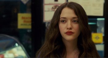 Movie still from “Nick and Norah's Infinite Playlist” (2008), directed by Peter Sollett – A person with long brown hair; Close Up shot, Over the shoulder angle