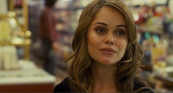 Movie still from “Nick and Norah's Infinite Playlist” (2008), directed by Peter Sollett – A beautiful woman with long brown hair wearing a black shirt; Close Up shot, Over the shoulder angle