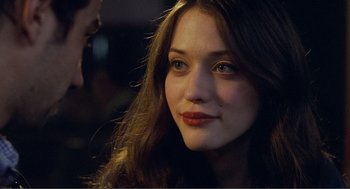 Movie still from “Nick and Norah's Infinite Playlist” (2008), directed by Peter Sollett – A person with long brown hair; Close Up shot, Over the shoulder angle