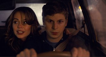 Movie still from “Nick and Norah's Infinite Playlist” (2008), directed by Peter Sollett – A man and a woman in the back seat of a car; Close Up shot, Over the shoulder angle