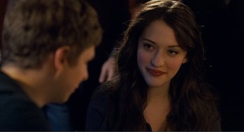 Movie still from “Nick and Norah's Infinite Playlist” (2008), directed by Peter Sollett – A young woman sitting next to a young man in a room; Close Up shot, Over the shoulder angle